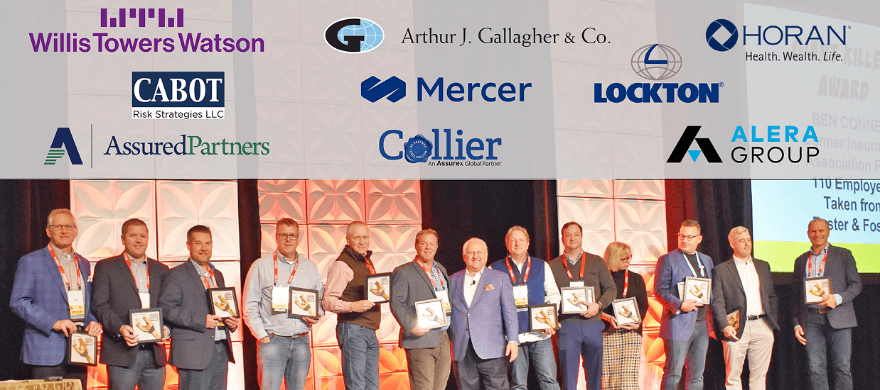 Giant Killer Award winners 2022 on stage at ASCEND, with sponsor logos