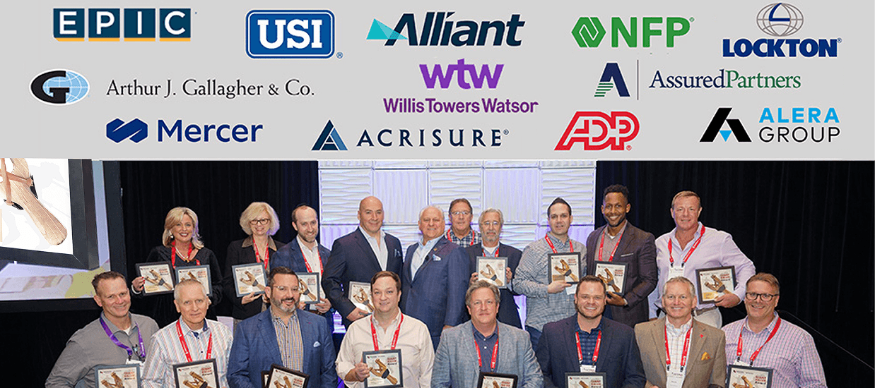 Giant Killer Award winners 2023 on stage at ASCEND, with sponsor logos