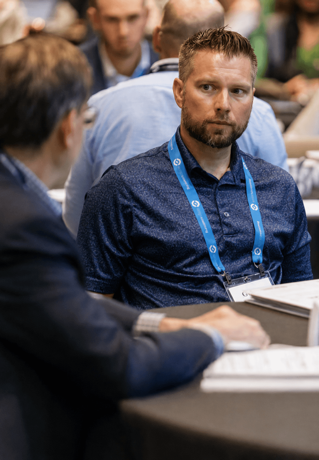 An adviser listening intently during an expert roundtable at ASCEND